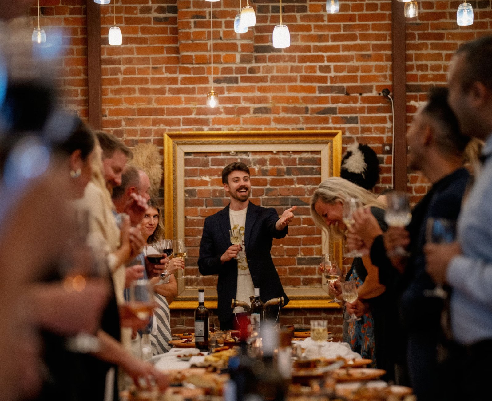 Daniel Padrnos raising a toast as Tamada at a Supra Dinner Society gathering